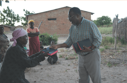 a man evangelizing to a local community member
