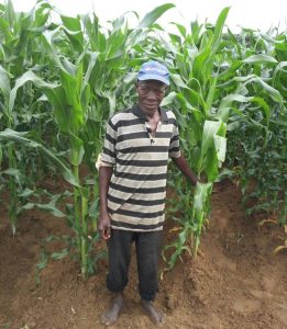 McCloud Kasiya standing in front of a cornfield